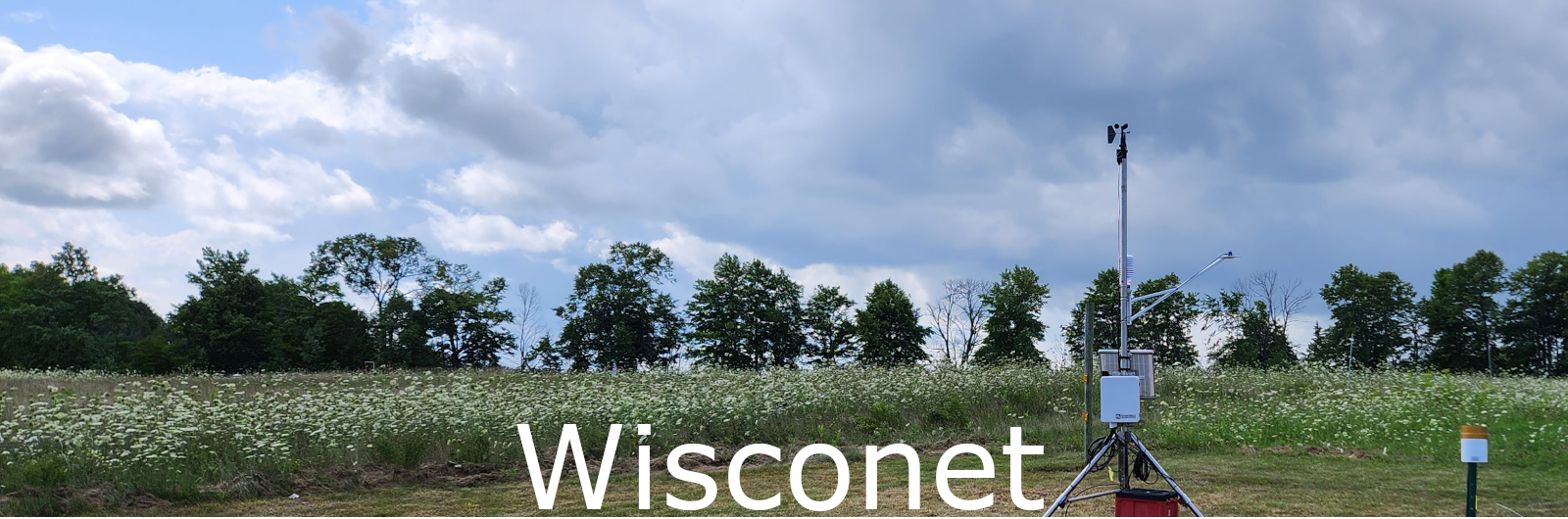 Hero image showing sunrise over a farm field with Wisconet text on top